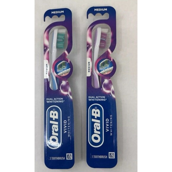 Lot of 2 ORAL B Vivid Whitening Toothbrush Medium Purple Blue New Sealed - Picture 1 of 6